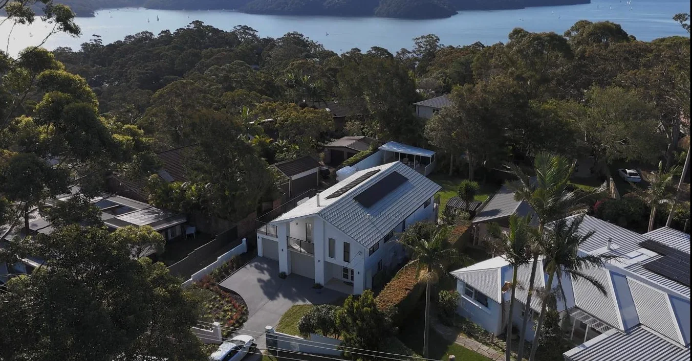 Drone shot over a waterfront home install