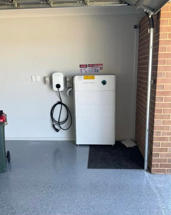 Sigenergy battery and EV charger installed clean in a garage