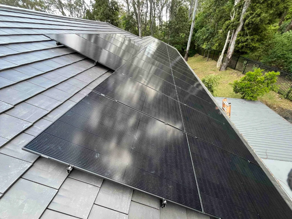 Solar panels on a tiled roof in a rural setting